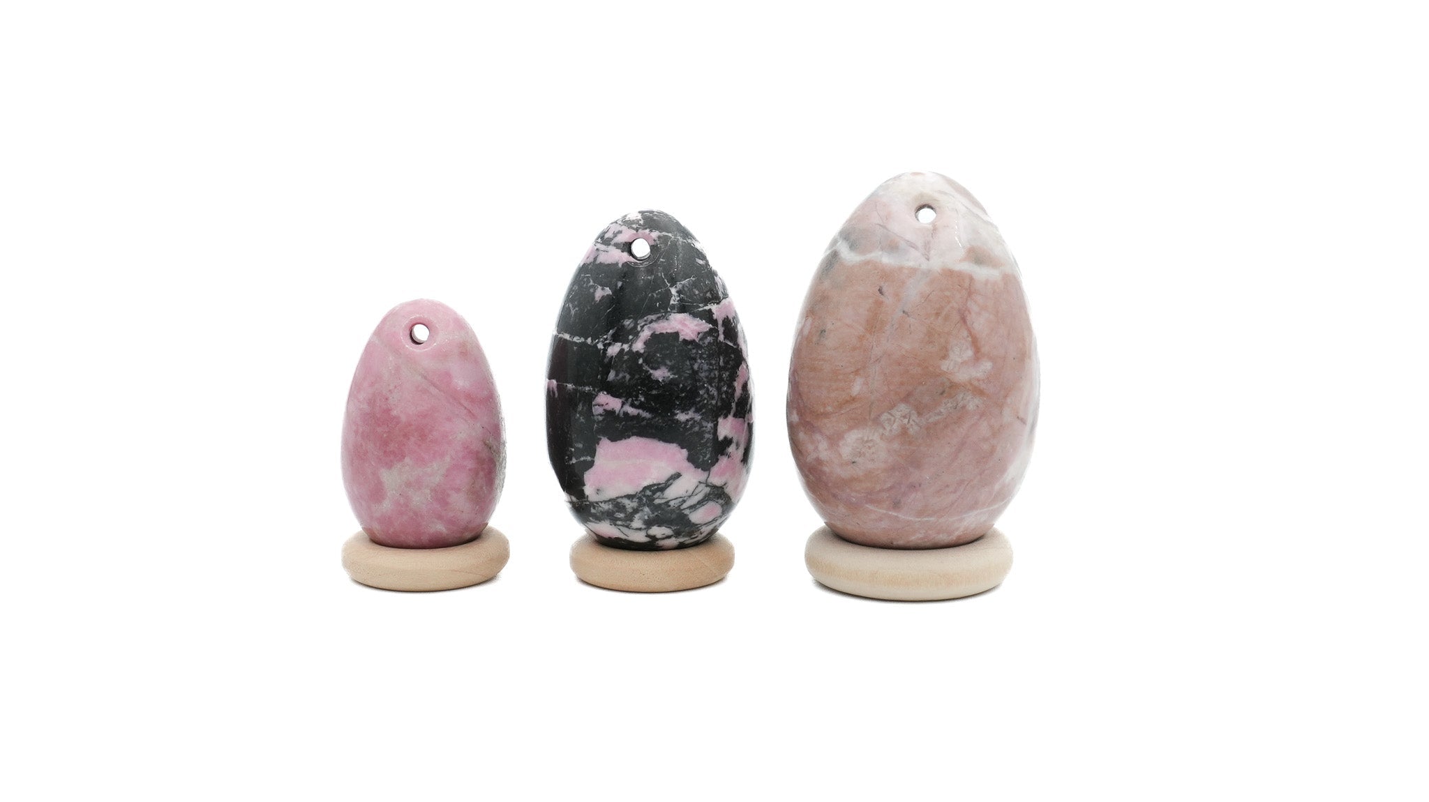 kit avec trois oeufs de yoni en rhodonite cote a cote
